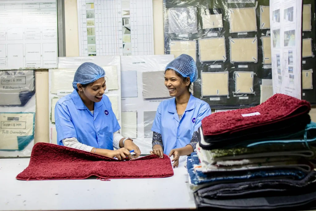 two workers are checking the quality of the product