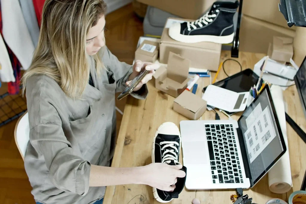 the owner of the shoes's online store receiving the order from her online store