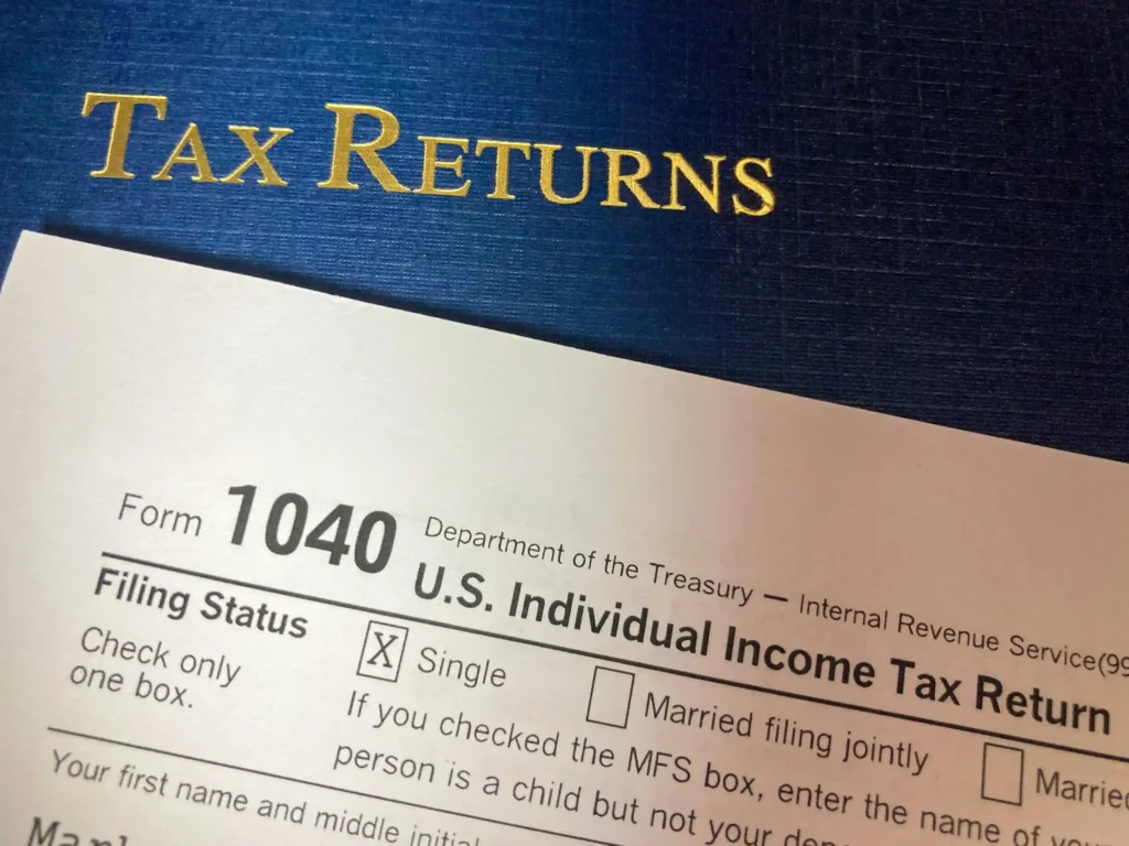 tax returns in yellow color is written on the blue background