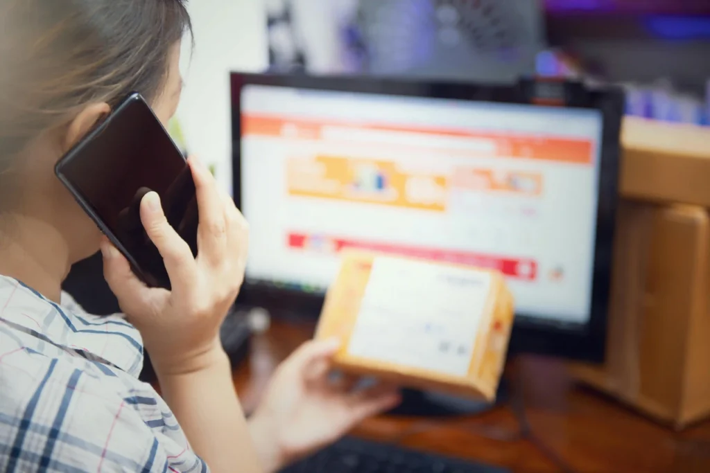 a woman confirming the order from his customer on phone call