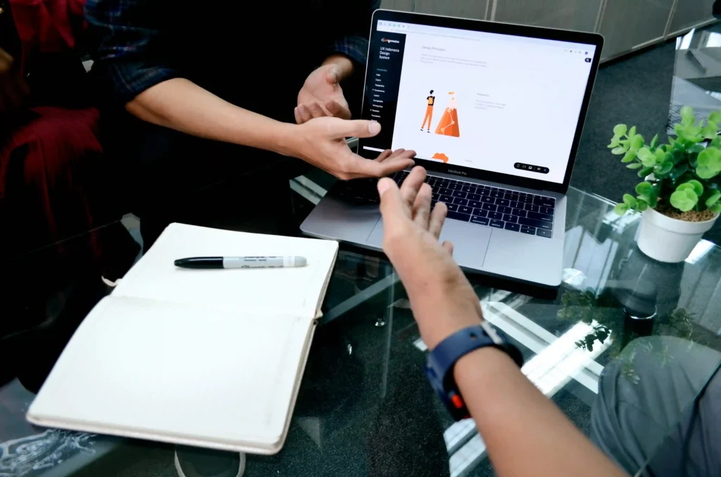 two experts are doing research for the winning product on laptop