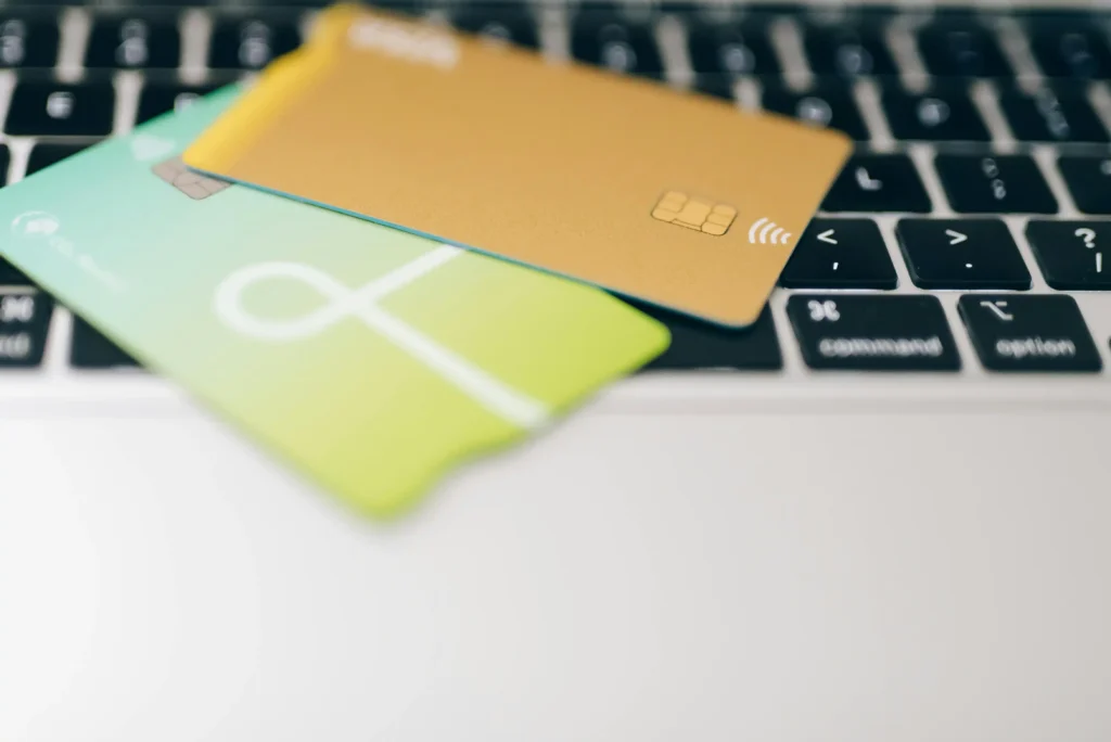 Fiverr payment system explained for freelancers in 2026 a laptop having two cards on it